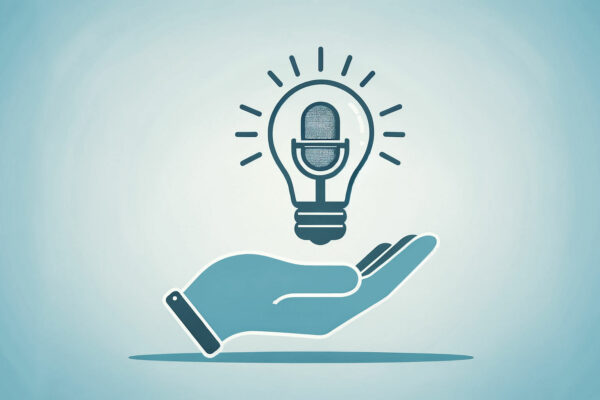 lightbulb containing a podcast microphone held in a hand